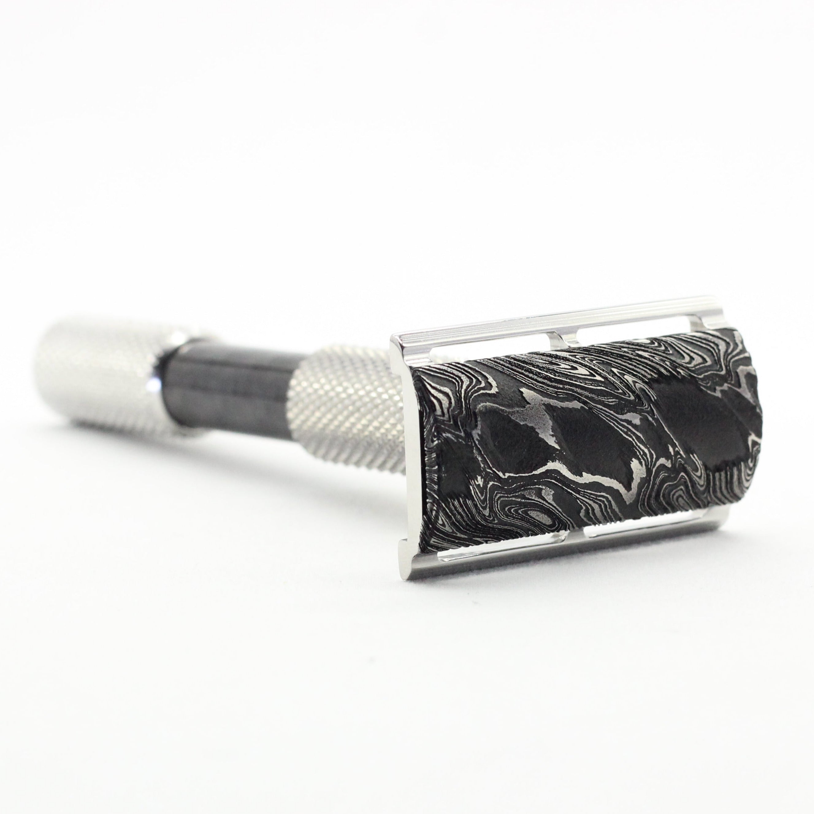 Vintage-style safety razor on a white background