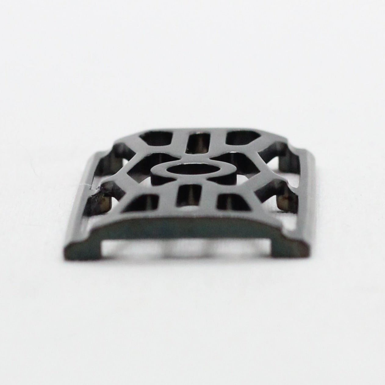 Close up side view of base plate with DLC or Diamond Like Carbon coating TAC coated carbon coating safety razor with pinch design shaver holds blade rigid - Polished Titanium single edge razor / double edge safety razor shaving - web plate / wet shaving - slickest surface finish