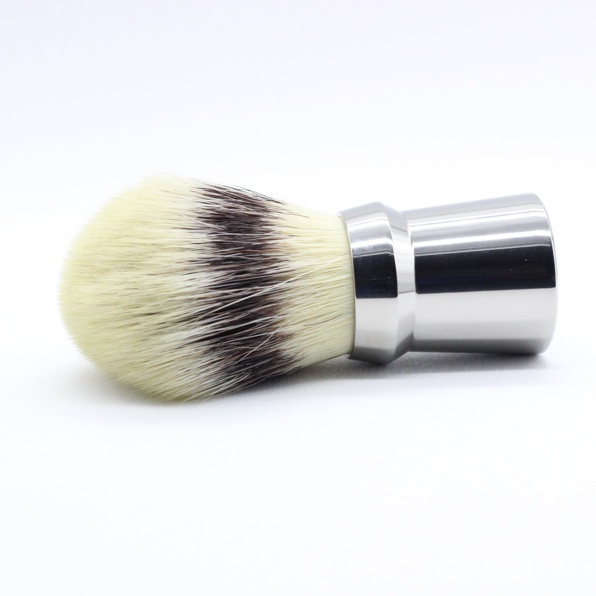 Horizontol view - Titanium Shaving brush - high polish finish to reduce places where dirt and bacteria can collect - Used to lift hairs and soften skin while shaving. Essential part of a grooming kit