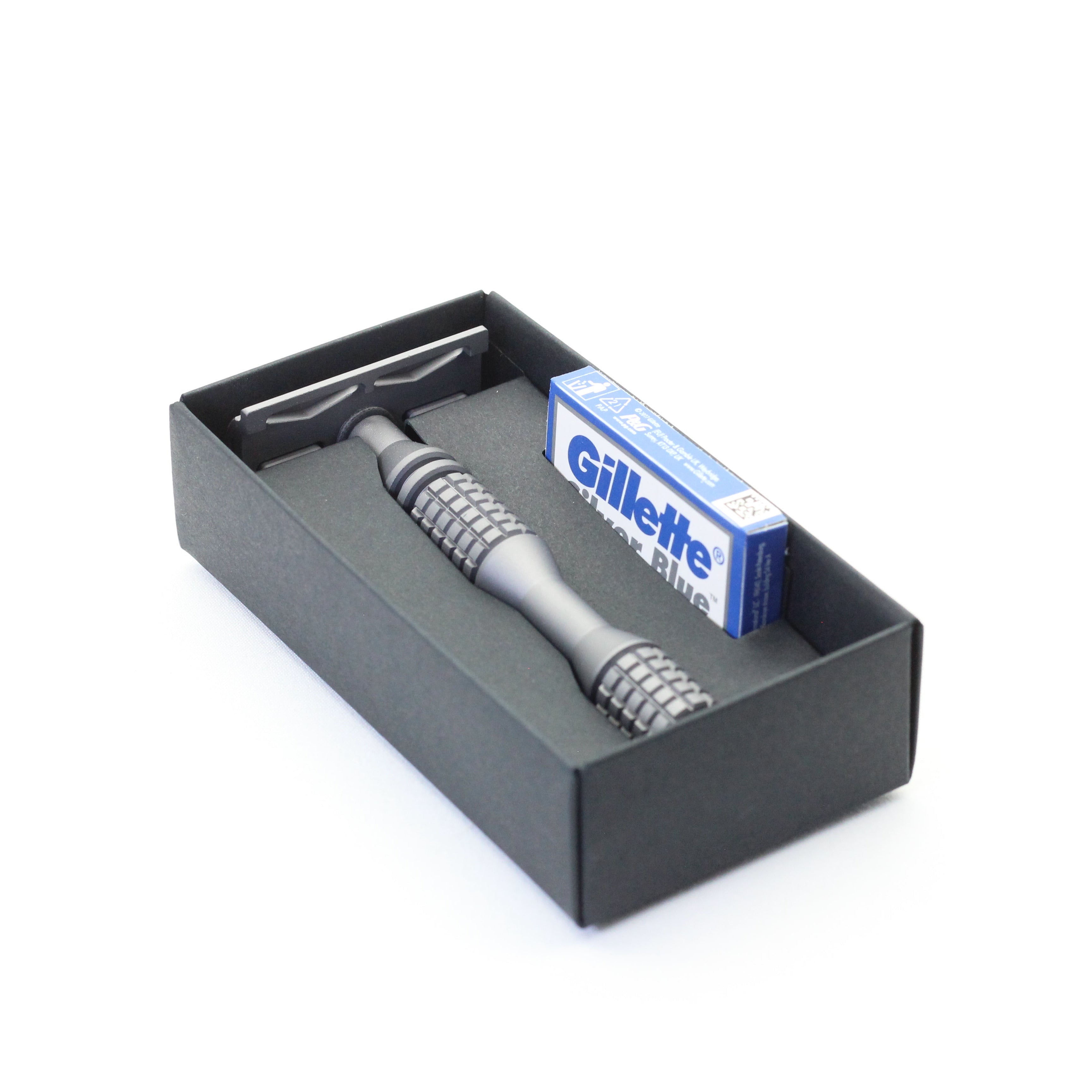 Gillette blades and shaving product set in a black box on a white background