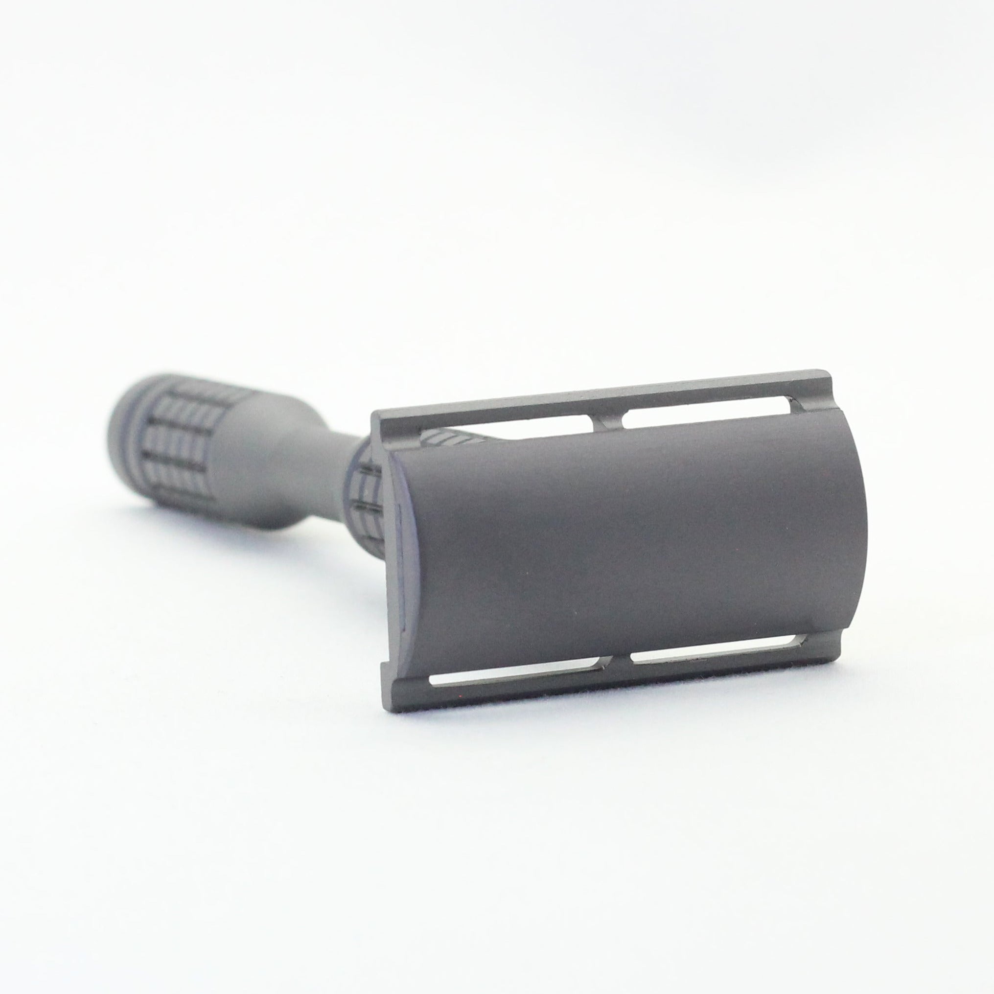 Gray safety razor on a white background