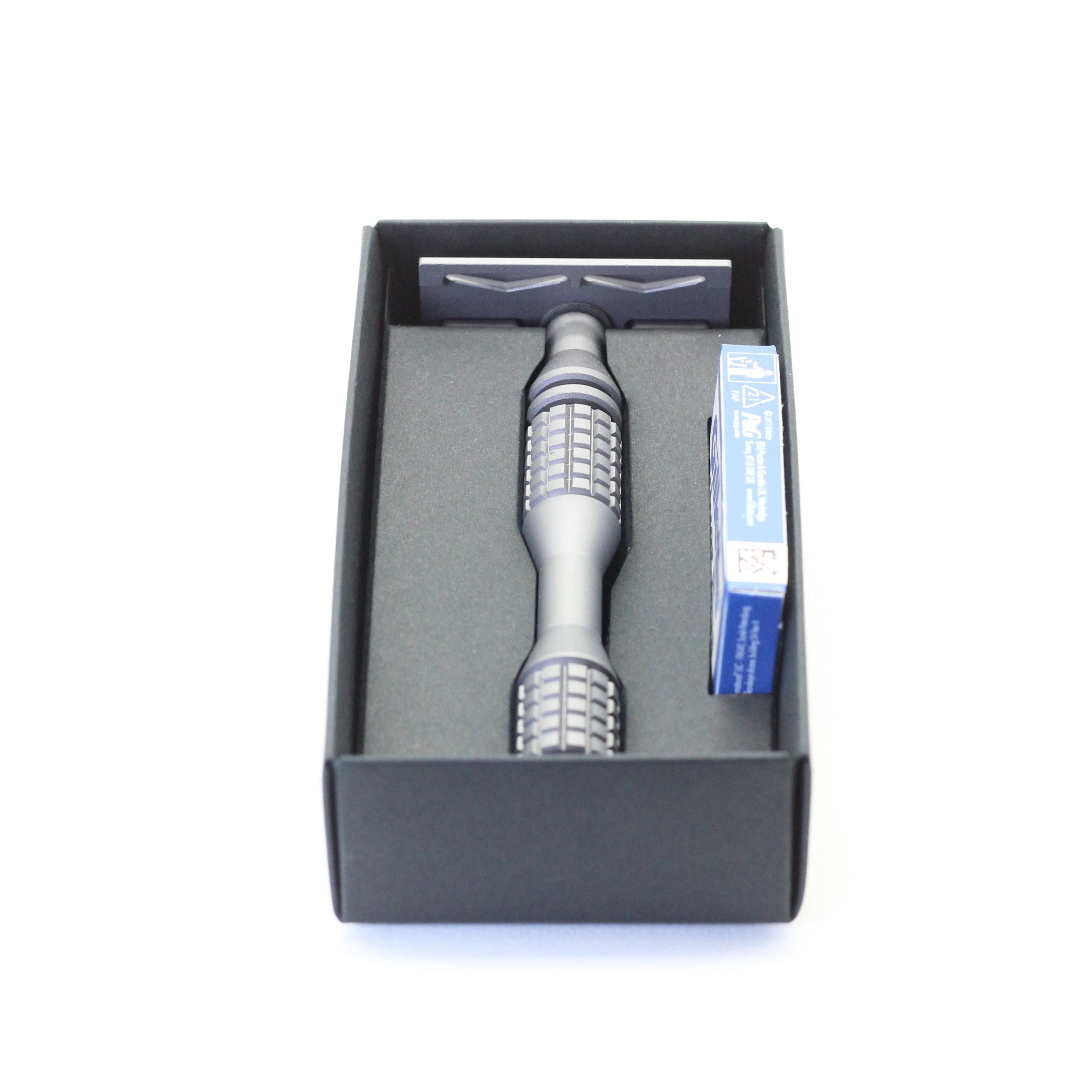 Safety razor tool in a black box on a white background