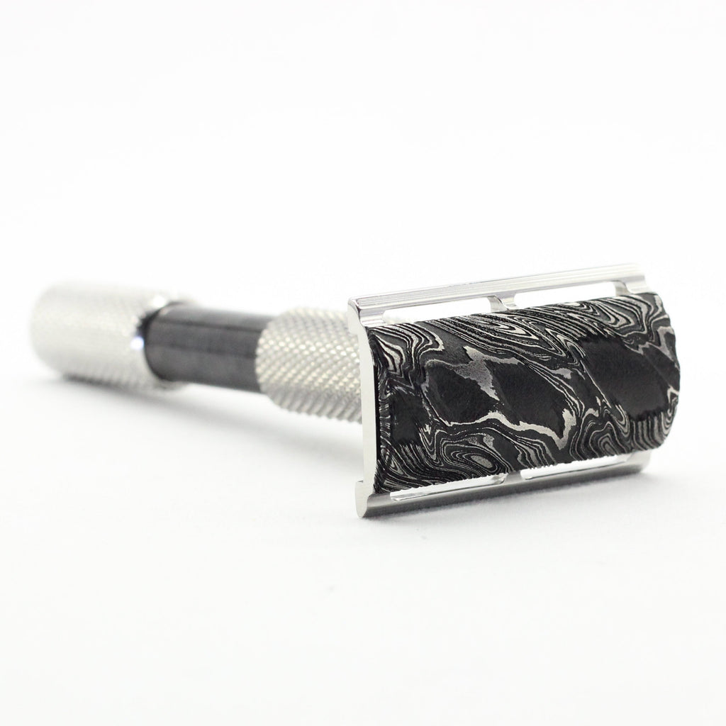Vintage-style safety razor on a white background