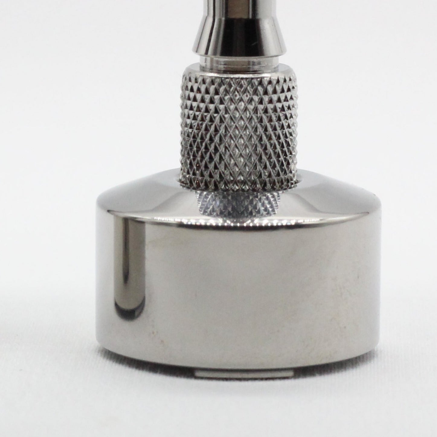 Snug fit safety razor stand - Close-up view - Titanium safety razor stand - Grade 5 Titanium alloy - Tripod feet to allow water and air to flow - polished finish - works with all carbon shaving co single edge safety shavers
